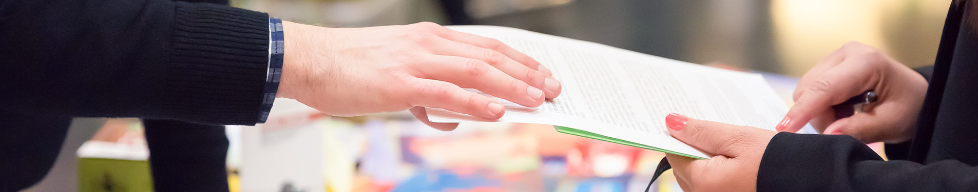 Hands holding a document